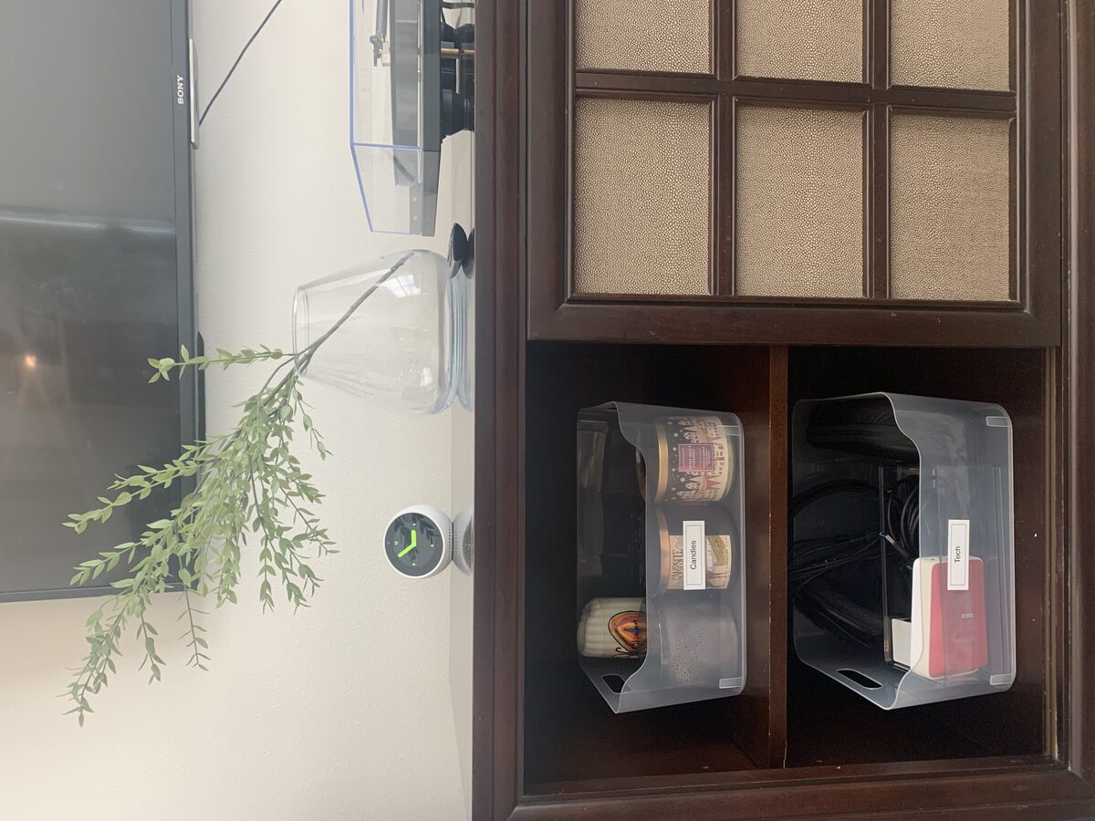 Media console with hidden cord management and organized AV storage — Simply Spacial in-home organizing, Sarasota