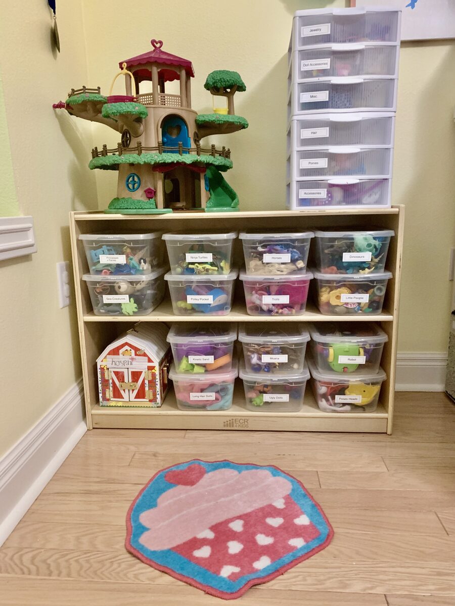 Toy storage room with labeled bins, low shelving, and activity-based zones — Simply Spacial ADHD-friendly home organizer, Lakewood Ranch