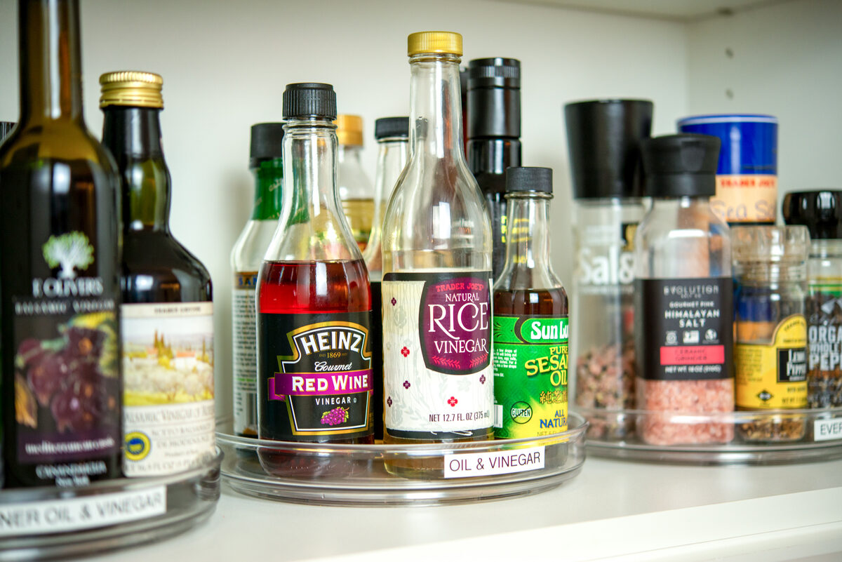 Pantry corner lazy susan with spices, condiments, and cooking essentials organized — Simply Spacial in-home organizer, Sarasota FL