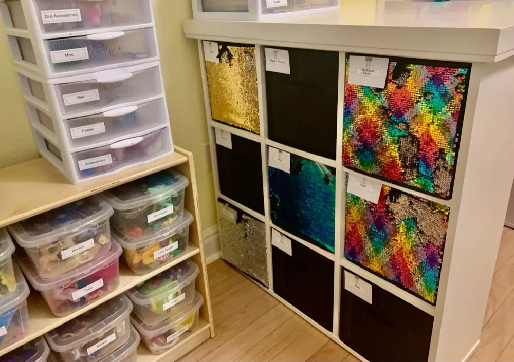 Labeled cubbies holding craft supplies